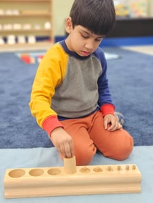 A child in daycare checking out a game in Sunnyvale, California.
