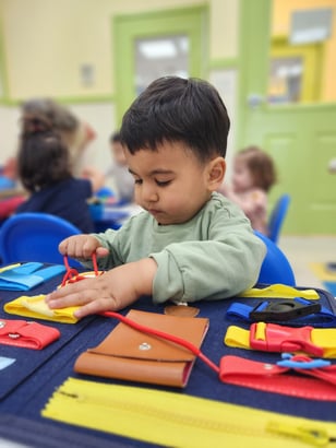 A child working on a Montessori 'job' at a top-rated preschool in Hercules, CA