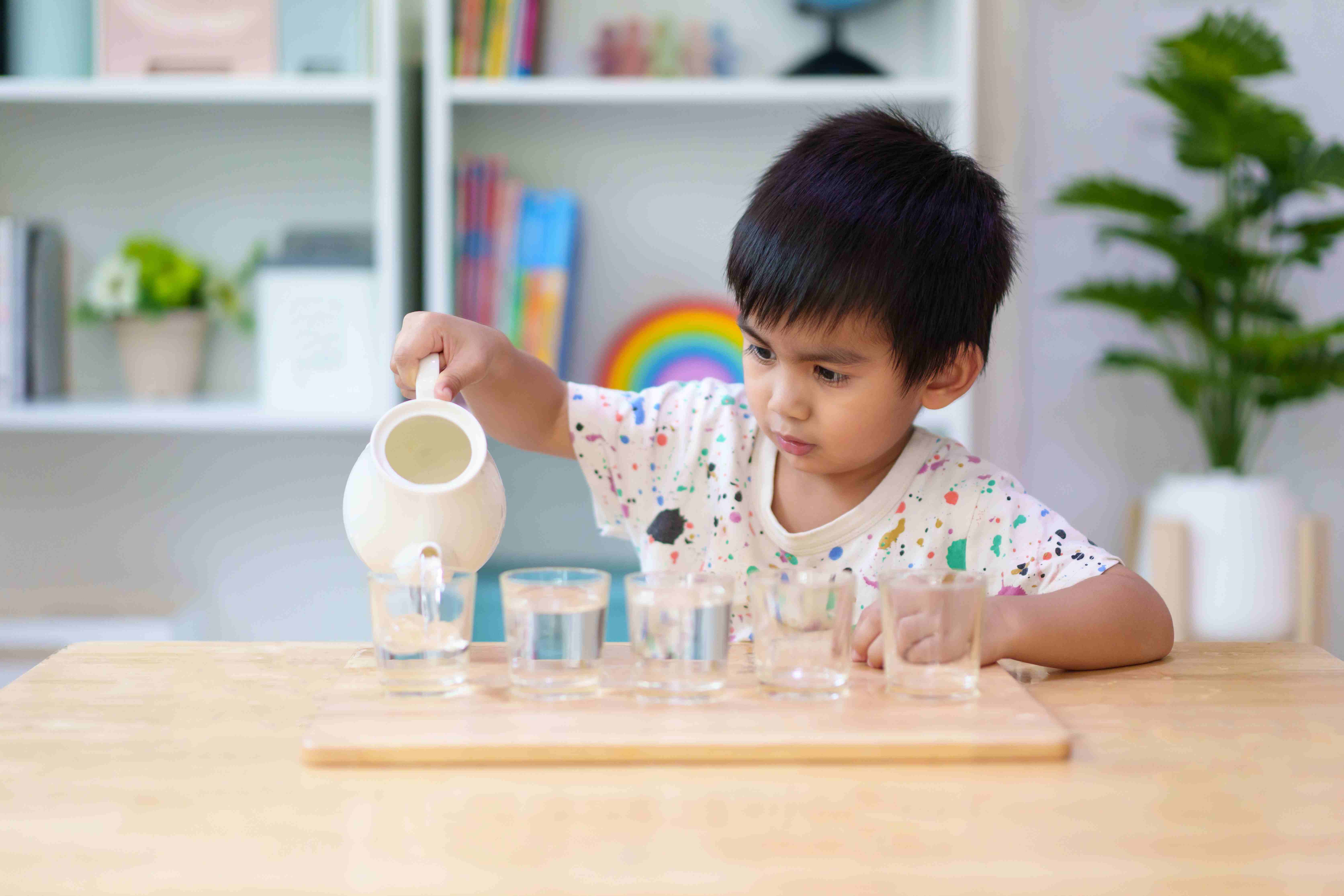 child pouring water