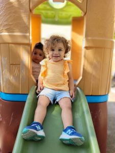 Child going down slide at the new Milpitas preschool.