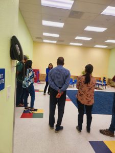 Happy parents at open house, learning about preschool opportunities for their kids in Milpitas.