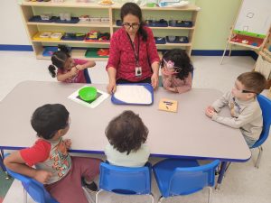 A preschool teacher working with students in Sunnyvale, California.