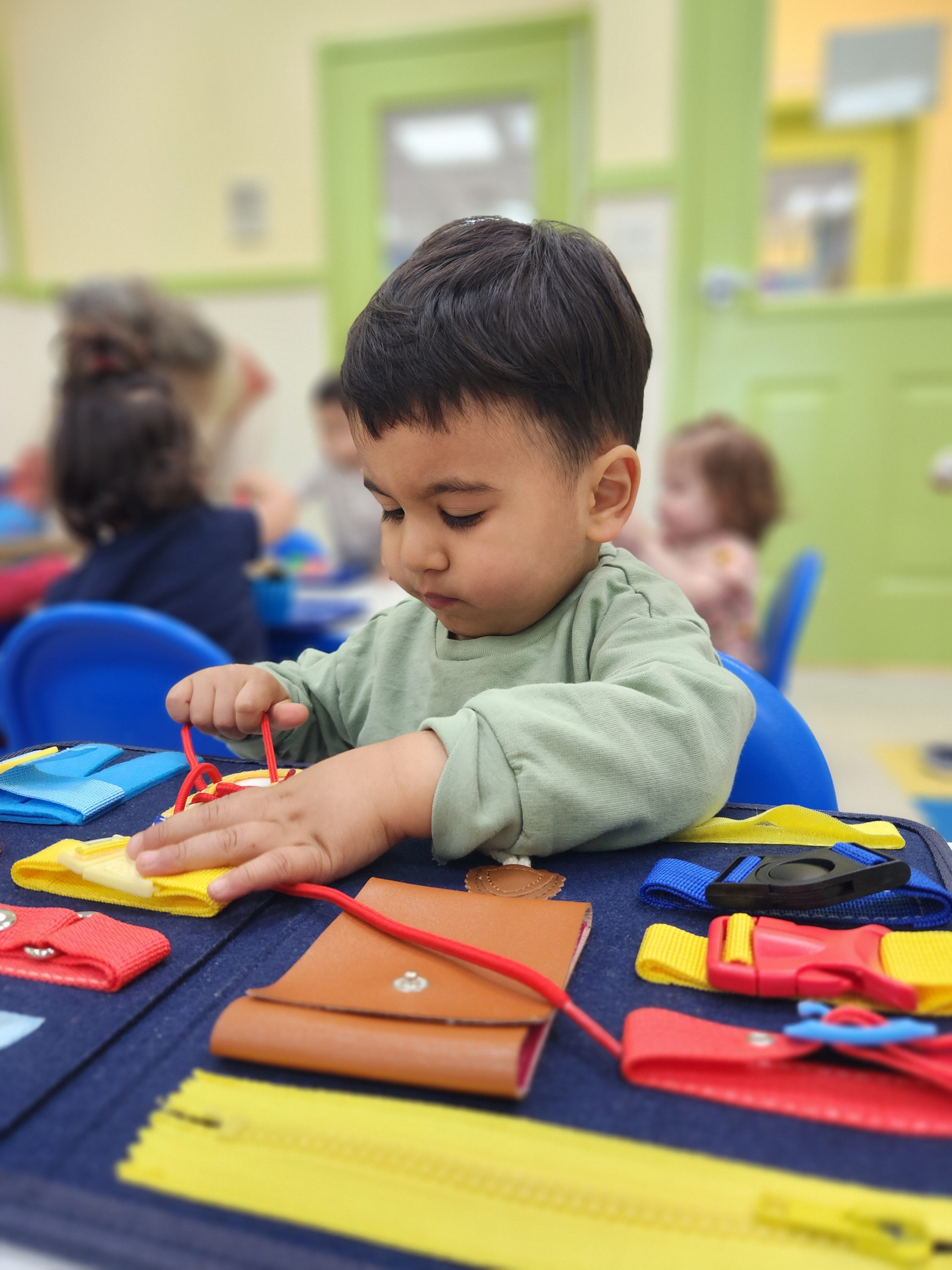 A child working on a Montessori 'job' at a top-rated preschool in Hercules, CA