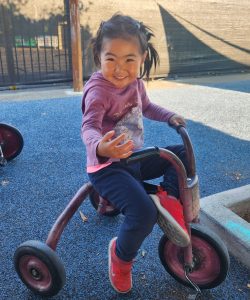 a happy student playing outdoors