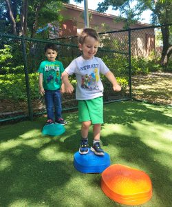 Moraga, California, daycare showcasing play among students.